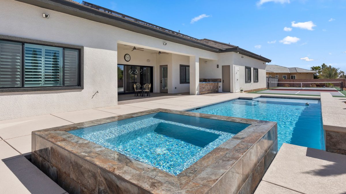 Custom pool and spa combo in a backyard.