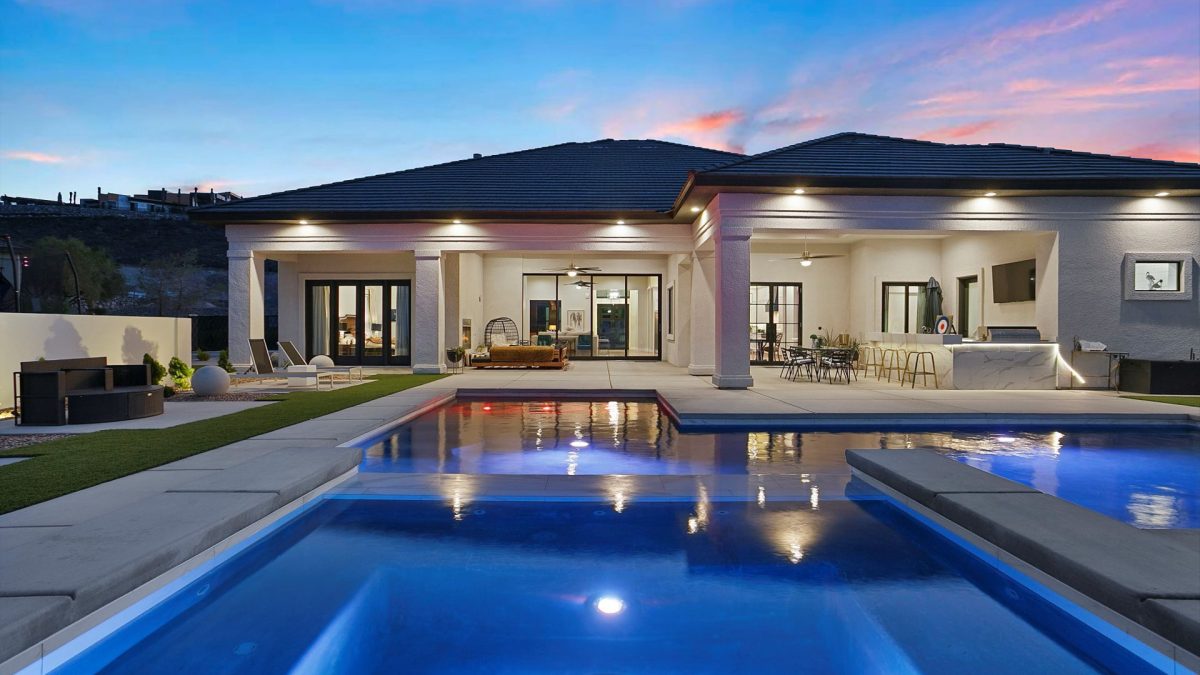 A modern Las Vegas residential pool pictured during sunset.